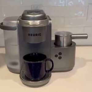 Keurig Silver Coffee Maker with Black Mug
